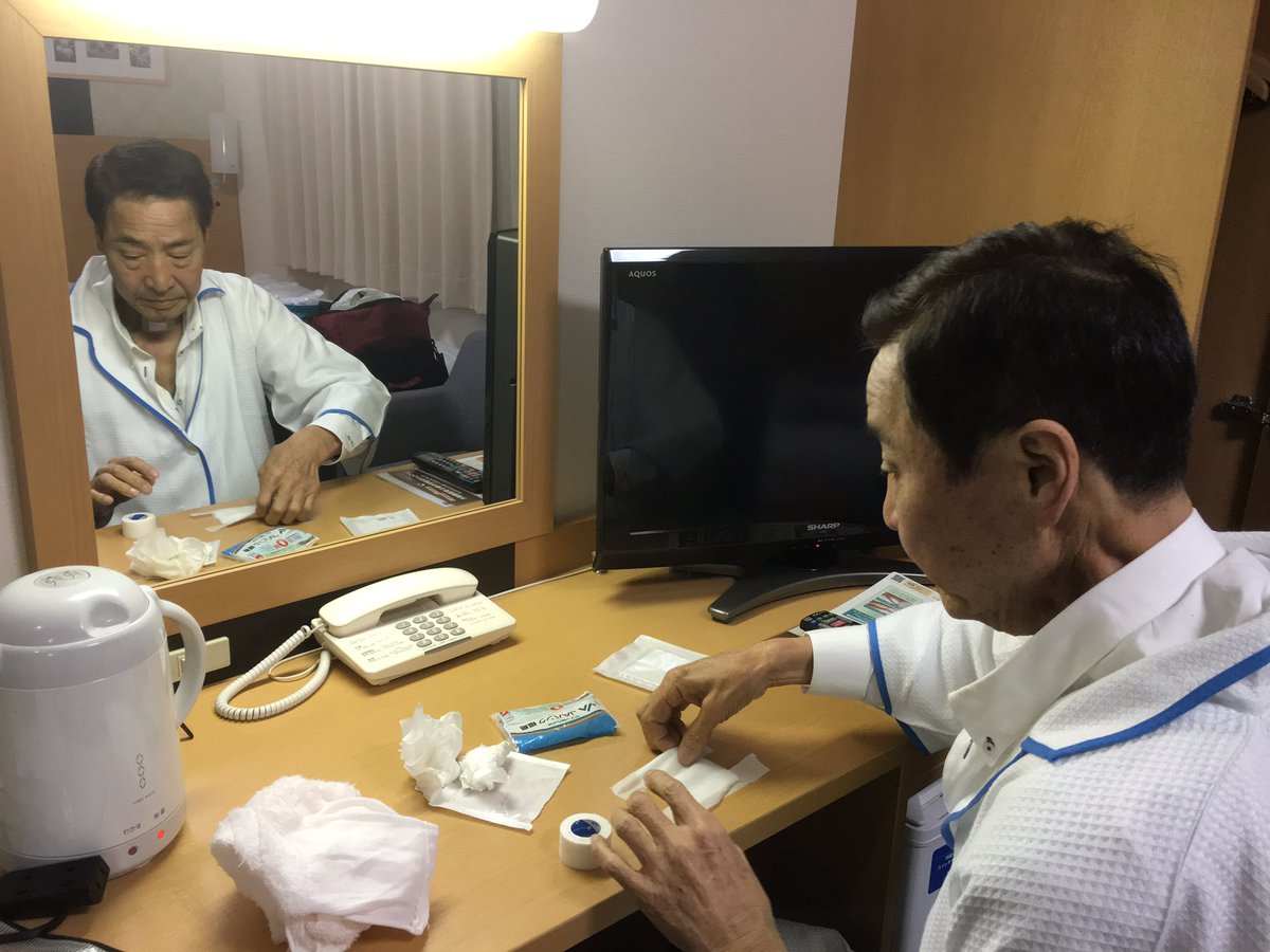 Before leaving to pick up his son, Mr. Hata changes bandage covering hole in his throat, a reminder of his cancer. https://t.co/tl1wAipWPt